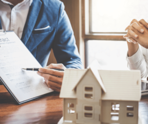 Mortgage broker with client going through contract