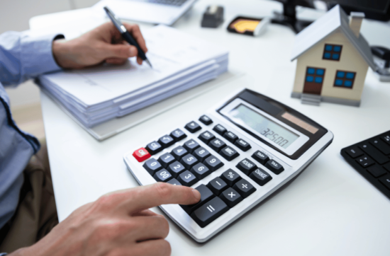 we are in a recession man with calculator and paper