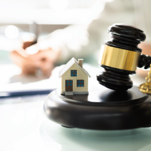 Auction hammer buying a house at auction