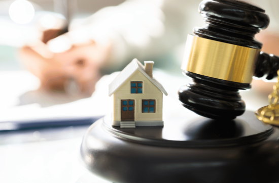 Auction hammer buying a house at auction